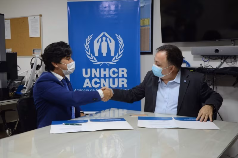O Sub-Defensor Público-Geral Federal, Jair Soares, e o Representante do ACNUR no Brasil, Jose Egas, assinam a renovação do Memorando de Entendimento - ACNUR/Vanessa Beltrame - Jornal O São Paulo