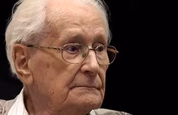 Former bookkeeper at Auschwitz Groening arrives for trial in Lueneburg
