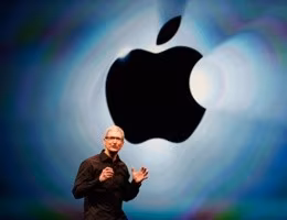 apple-sign-tim-cook-stage-614x409