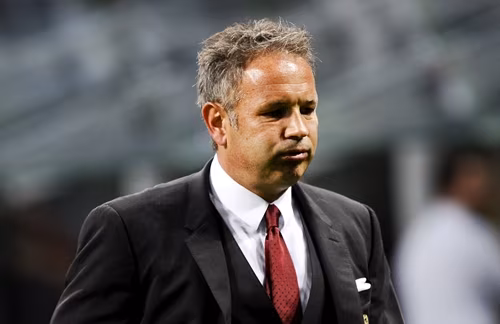 Mihajlovic reacts at the end of the first half during their Italian Serie A soccer match against Napoli at the San Siro stadium in Milan