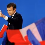 Emmanuel Macron, head of the political movement En Marche !, or Onwards !, and candidate for the 2017 French presidential election, gestures to supporters after the first round of 2017 French presidential election in Paris