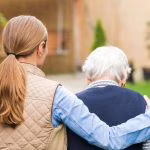 38190570 - young carer walking with the elderly woman in the park