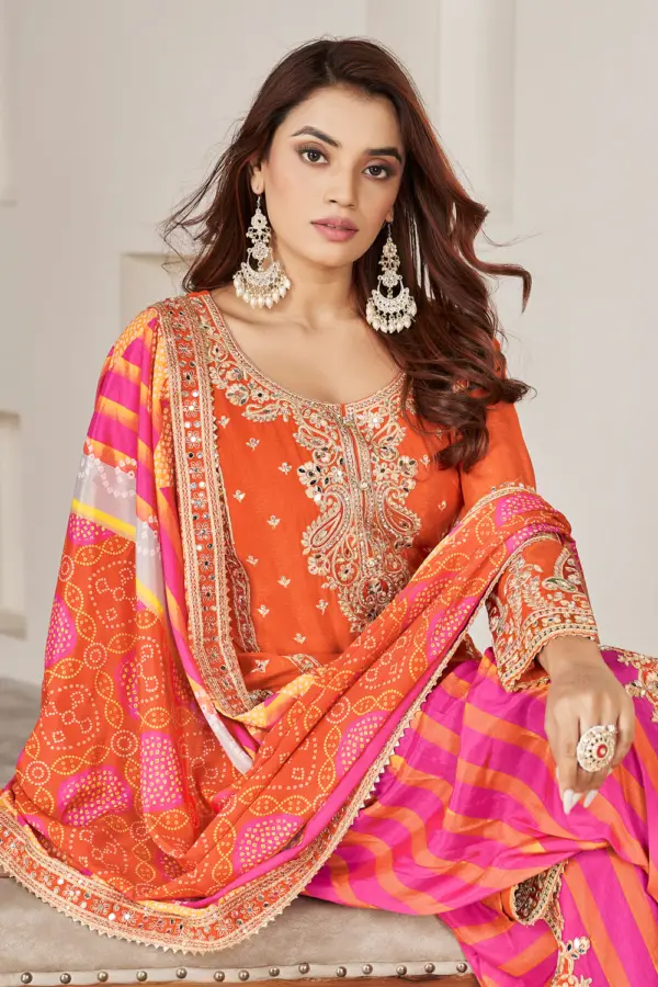 Handmade mirror work and dabka dori embroidery on orange chinon kurta