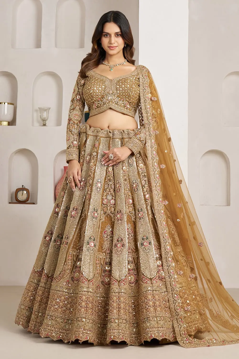 Gold bridal lehenga choli in antique gold with heavy embroidery by Khaish