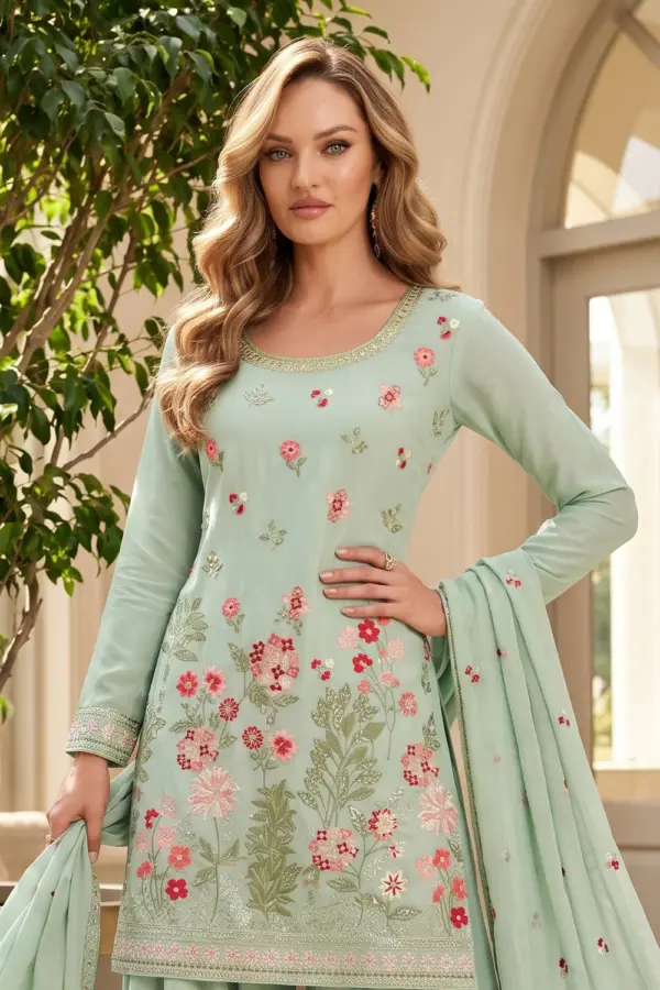 Close up of premium embroidery on sea green chinon kurta palazzo set