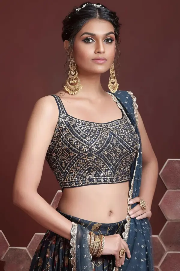 Swarovski crystals and heavy embroidery detail on blue silk lehenga