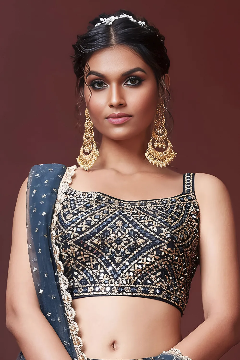 Digital print and embroidery work close up on blue silk lehenga