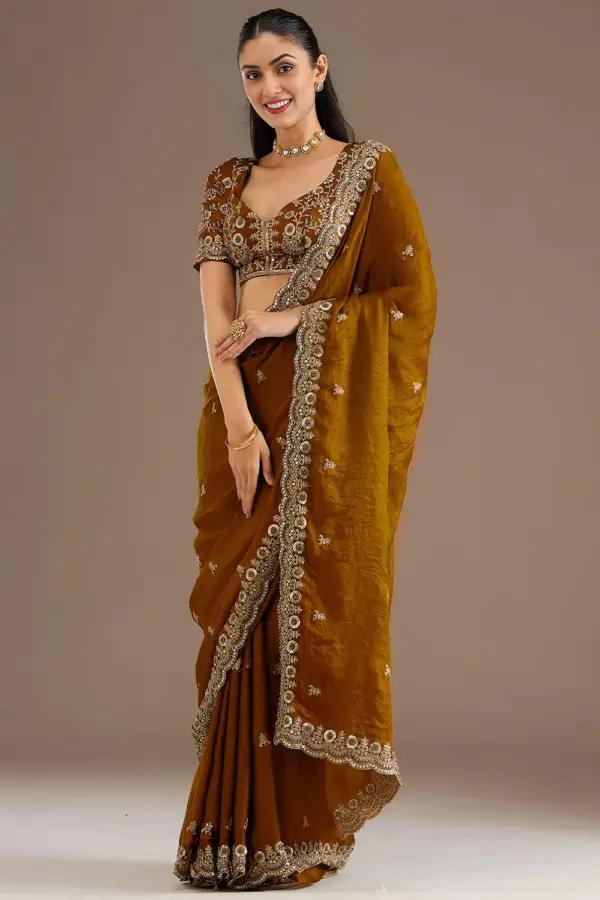 Gold tissue silk saree for wedding with sequins and zari work by Khaish