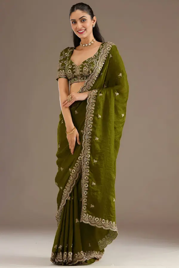 Olive green tissue silk saree with sequins and zari work by Khaish