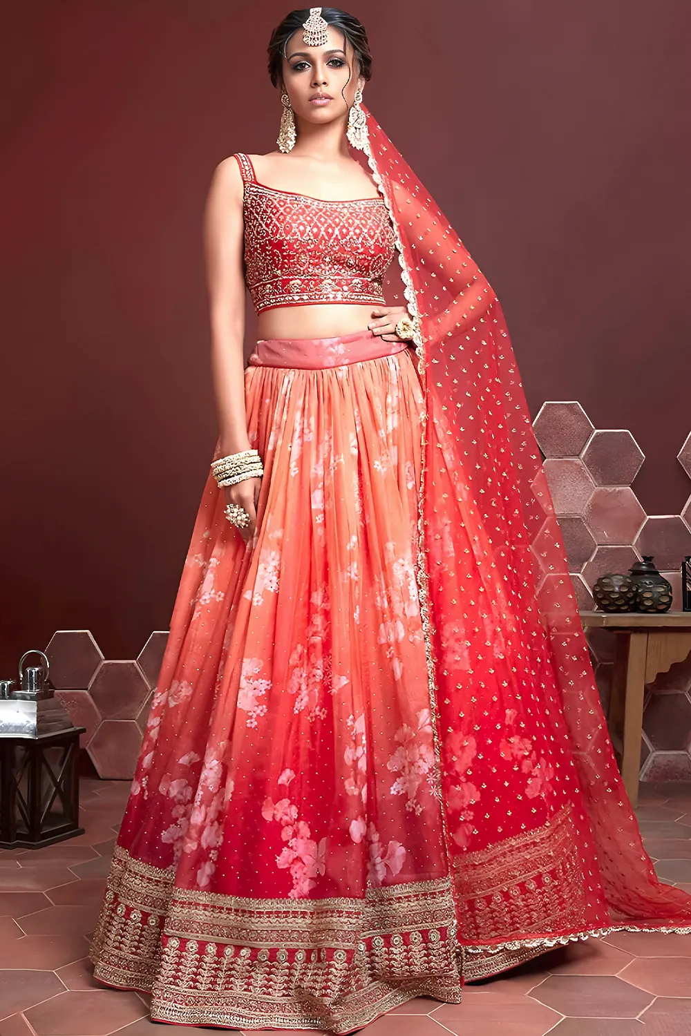 Orange silk lehenga with Swarovski, digital print and heavy embroidery by Khaish