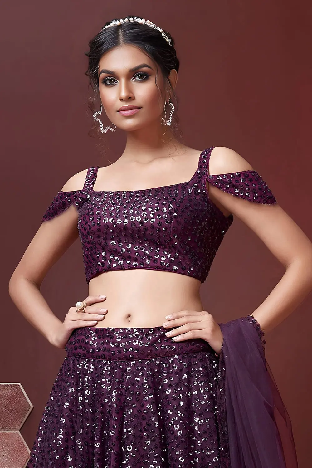 Swarovski crystals and heavy embroidery detail on purple silk lehenga