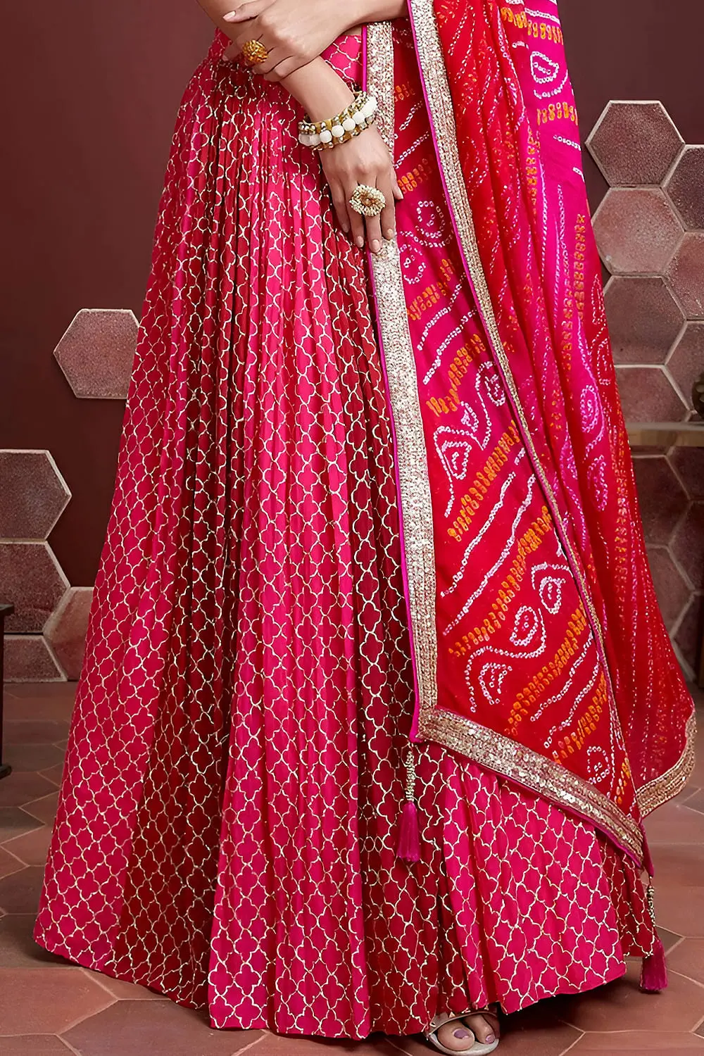 Pink silk lehenga hem with Swarovski crystals and digital print