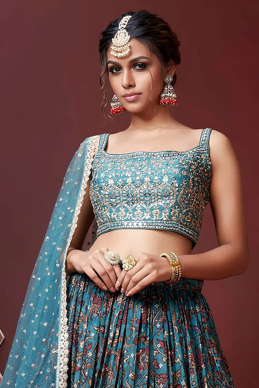 Digital print and embroidery work close up on sky blue silk lehenga