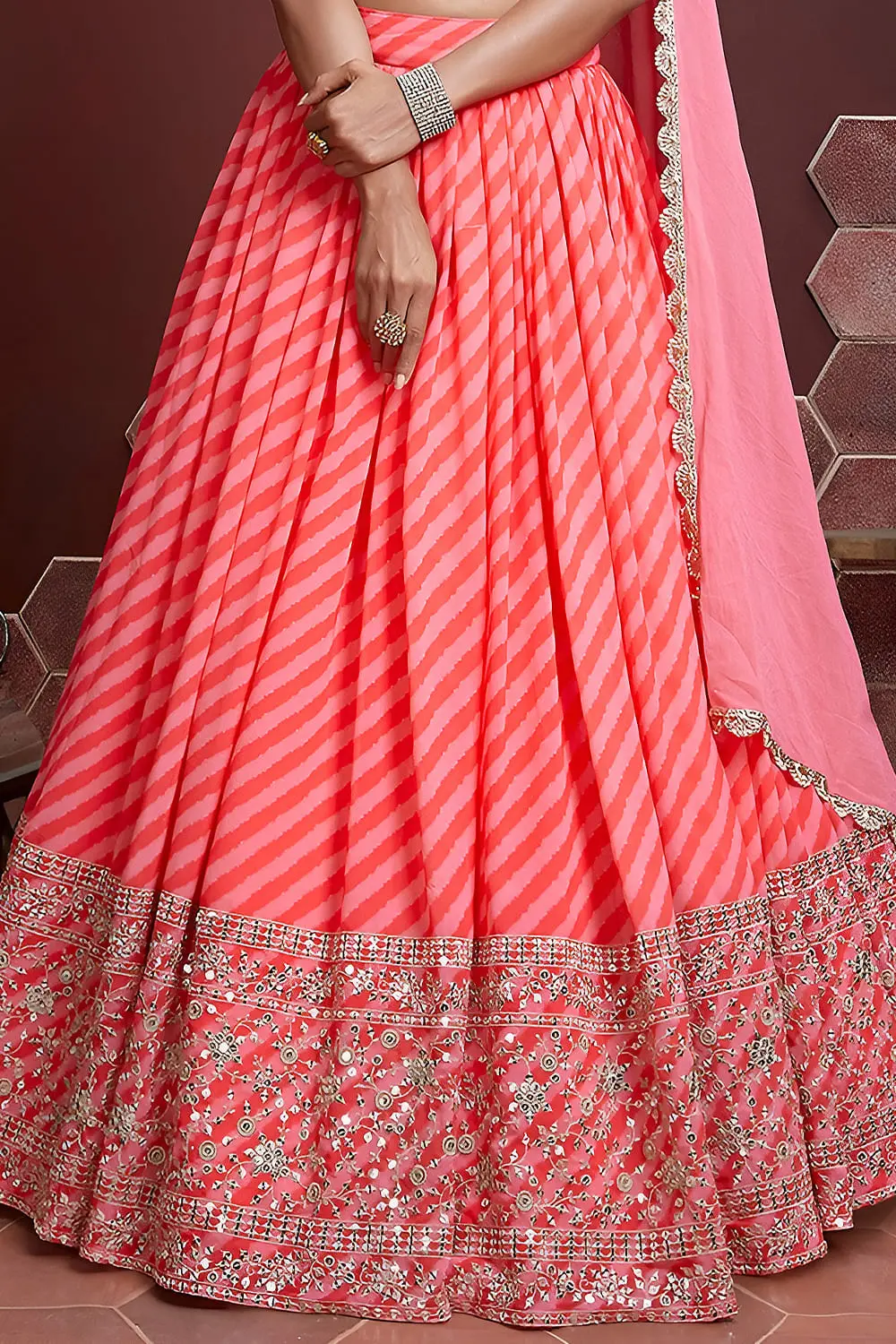 Peach silk lehenga hem with Swarovski crystals and digital print