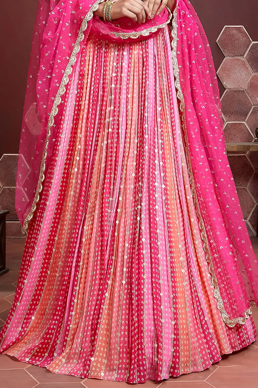 Pink silk lehenga hem with Swarovski crystals and digital print