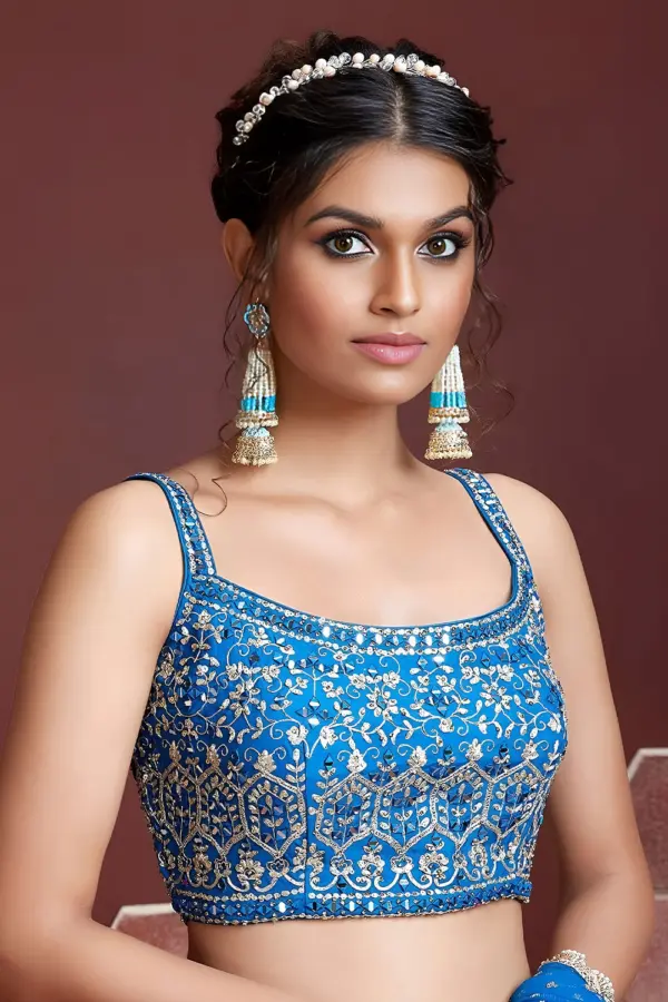 Swarovski crystals and heavy embroidery detail on sky blue sangeet lehenga