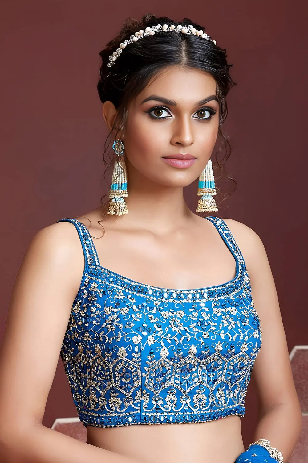 Swarovski crystals and heavy embroidery detail on sky blue sangeet lehenga