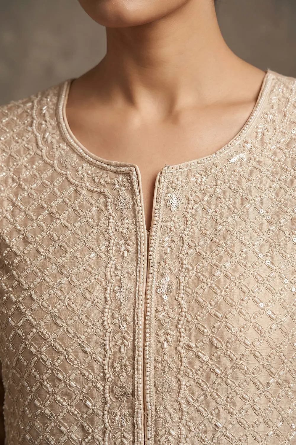 Close up of heavy look beads work and refined single pearl sleeve detailing