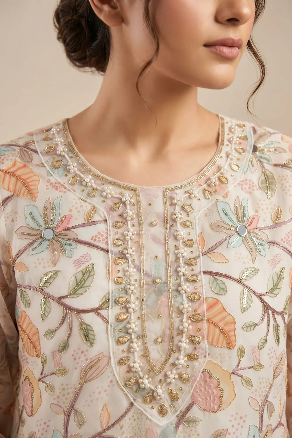Close up of cream organza kurta with handwork detail