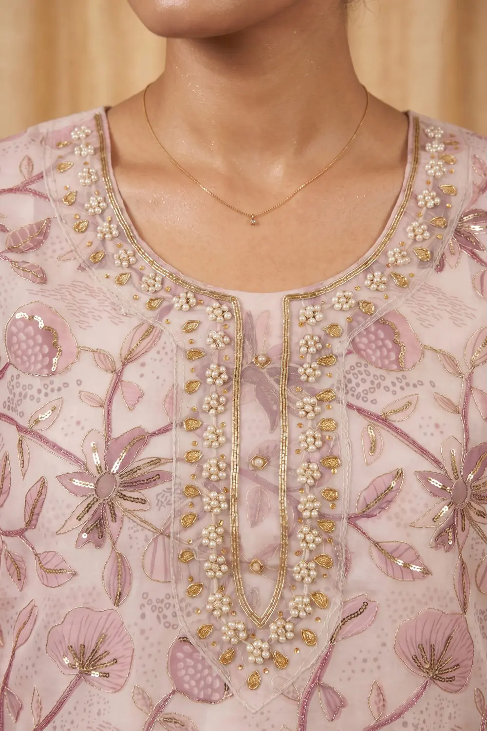 Close up of pink organza kurta with handwork detail