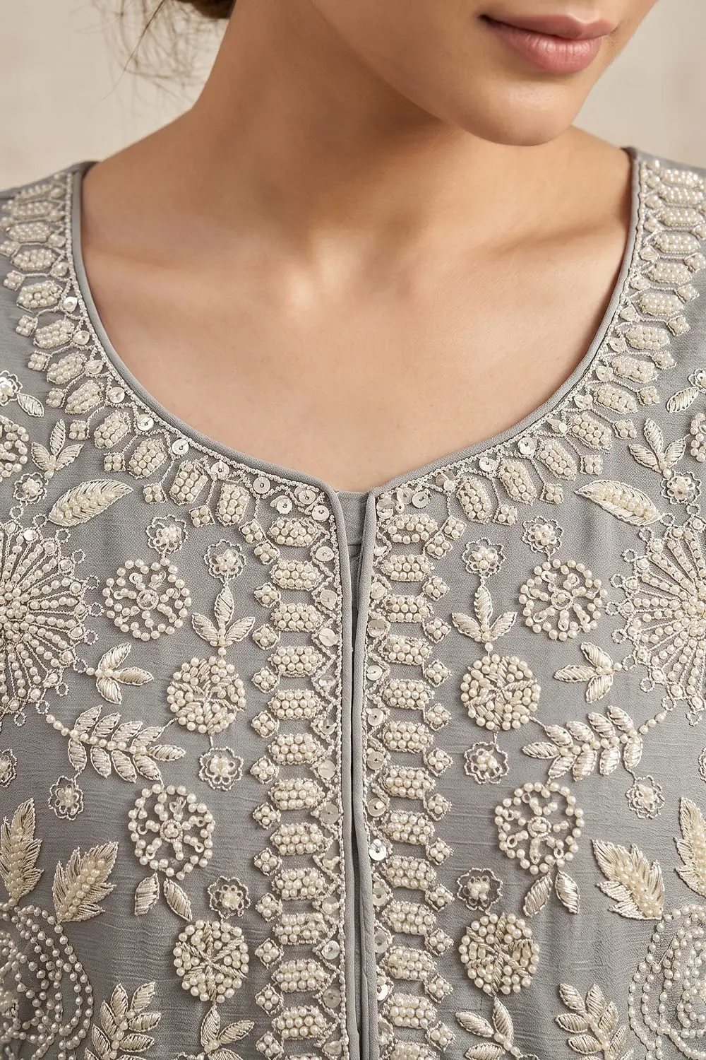 Ivory chinon kurta palazzo set with tassel-border dupatta seated view