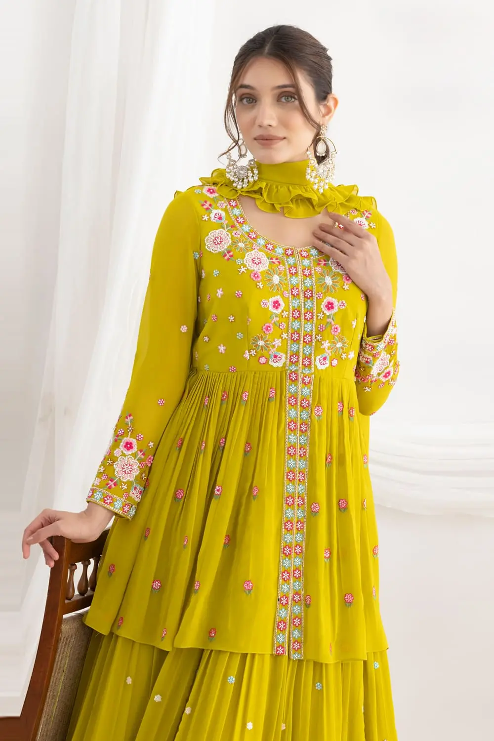 Elegant neckline with floral silk and beadwork on mustard georgette top