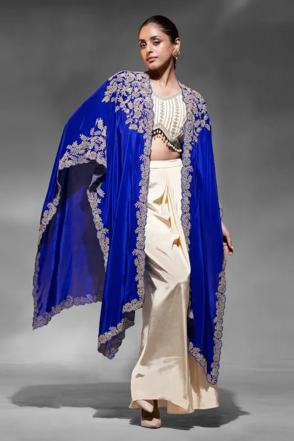 Indo western outfit for reception in blue crepe with embroidered shrug by Khaish