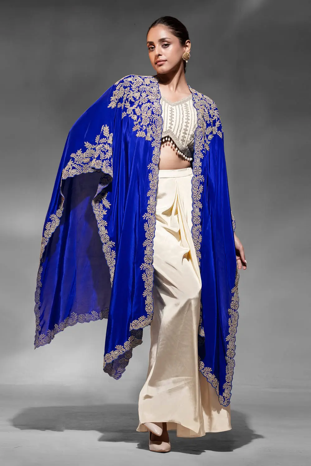 Indo western outfit for reception in blue crepe with embroidered shrug by Khaish