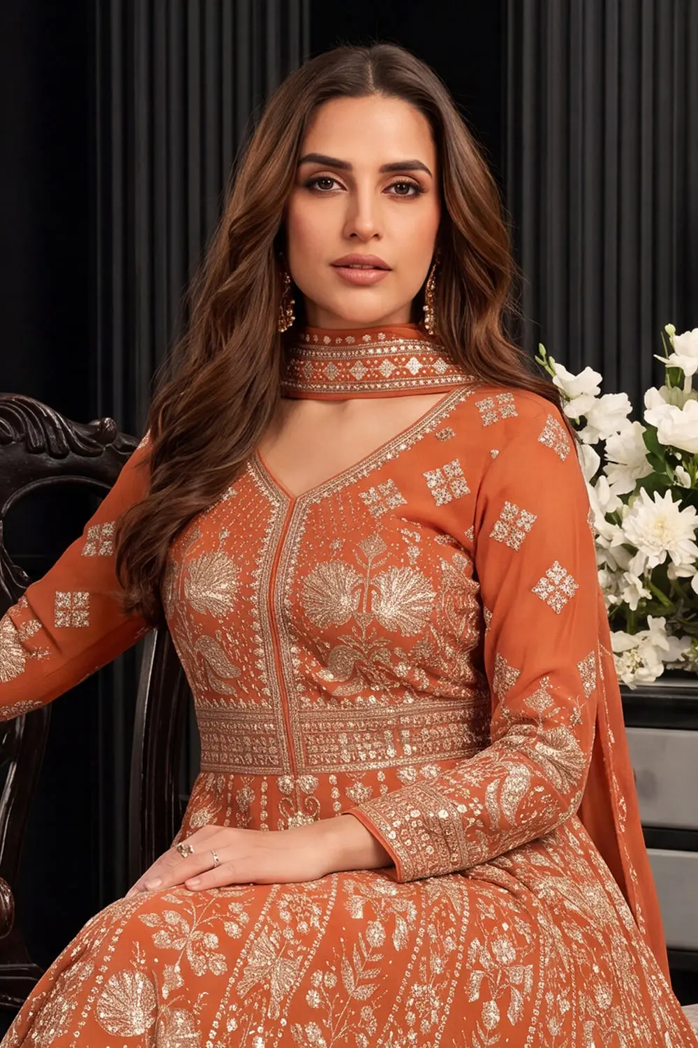 Close up of premium embroidery on orange georgette anarkali gown
