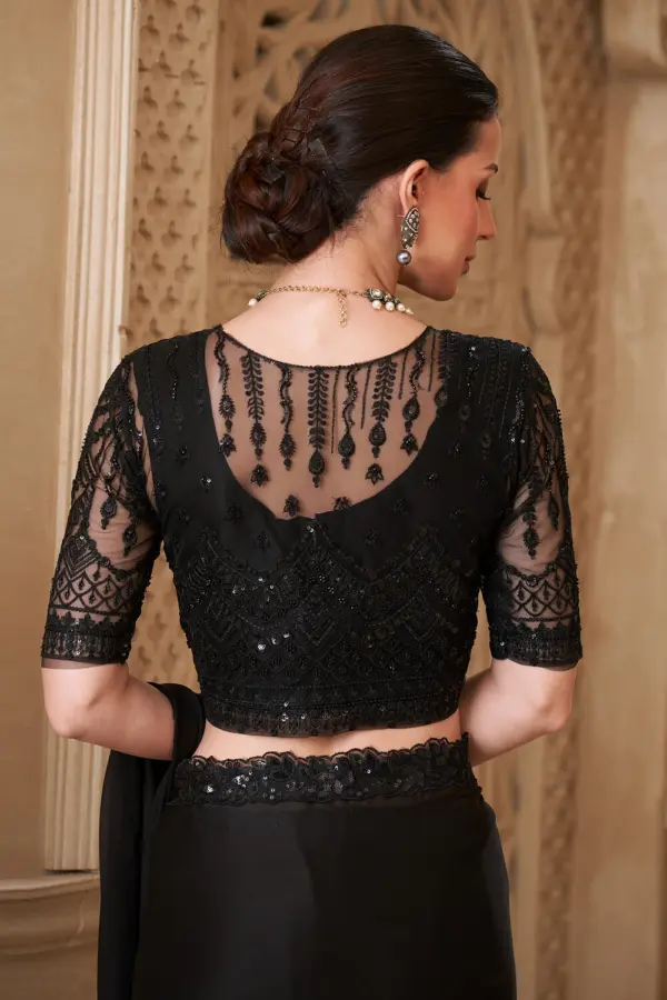 Close up of satin georgette drape and jacket work blouse in black