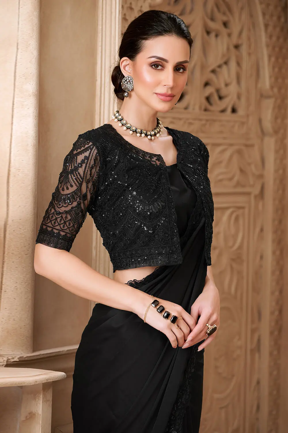 Jacket work blouse with embroidery detailing on black georgette saree