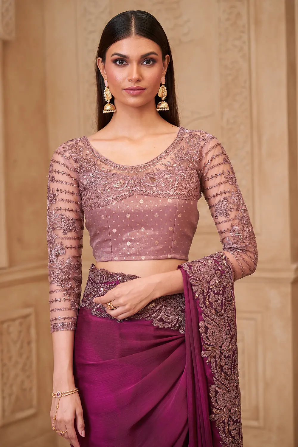 Brocade silk blouse paired with Wine Satin Georgette Embroidered Saree