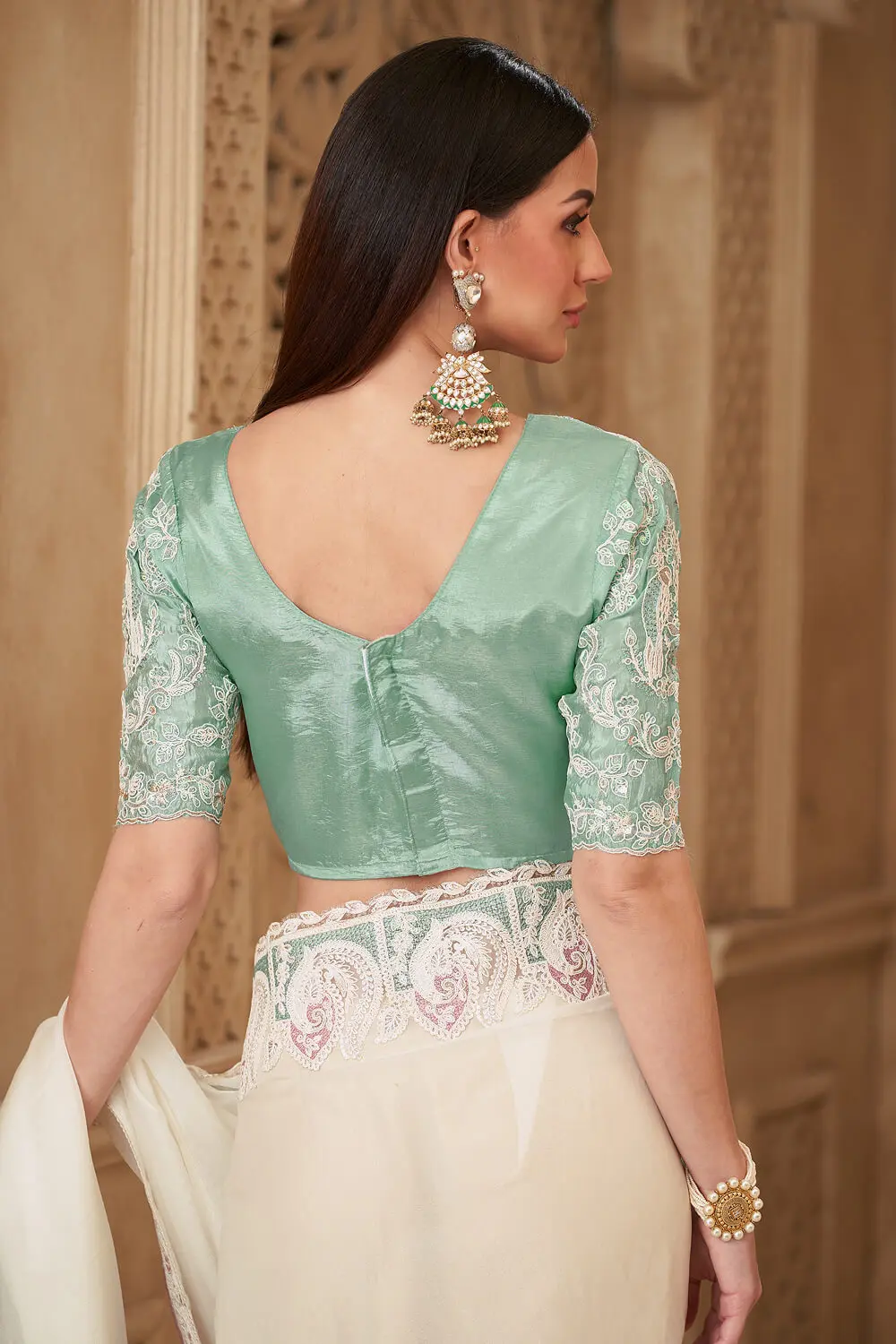 Back pallu view of Powder White Satin Georgette Embroidered Saree