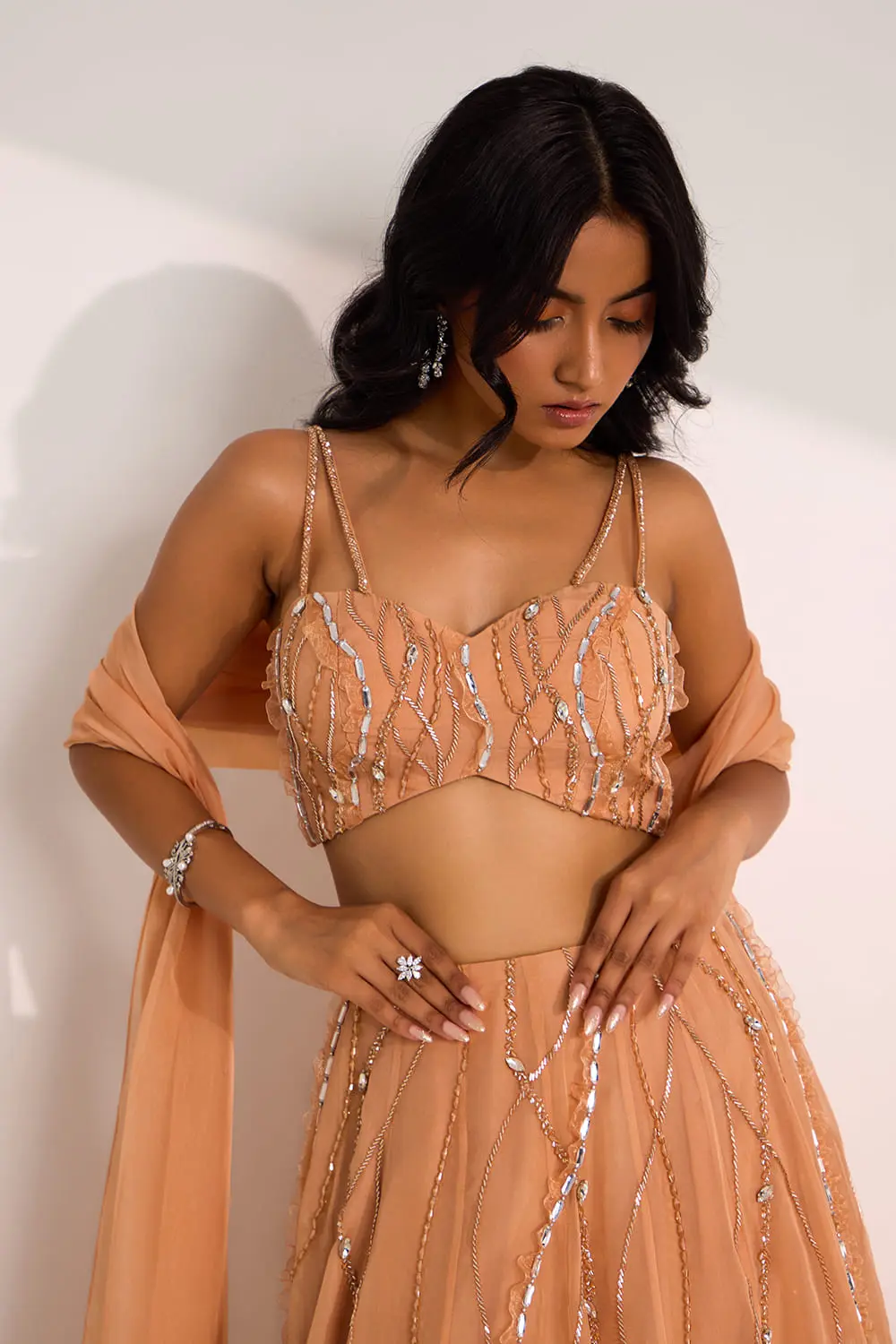 Close up of Ice Lines mix media embroidery on rose gold organza lehenga