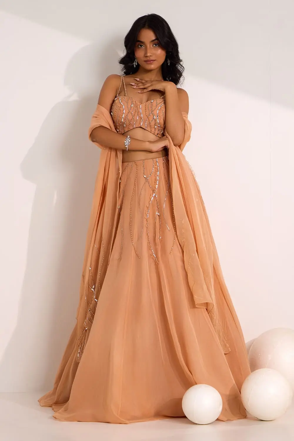 Rose gold organza lehenga with frosty mix media linework design