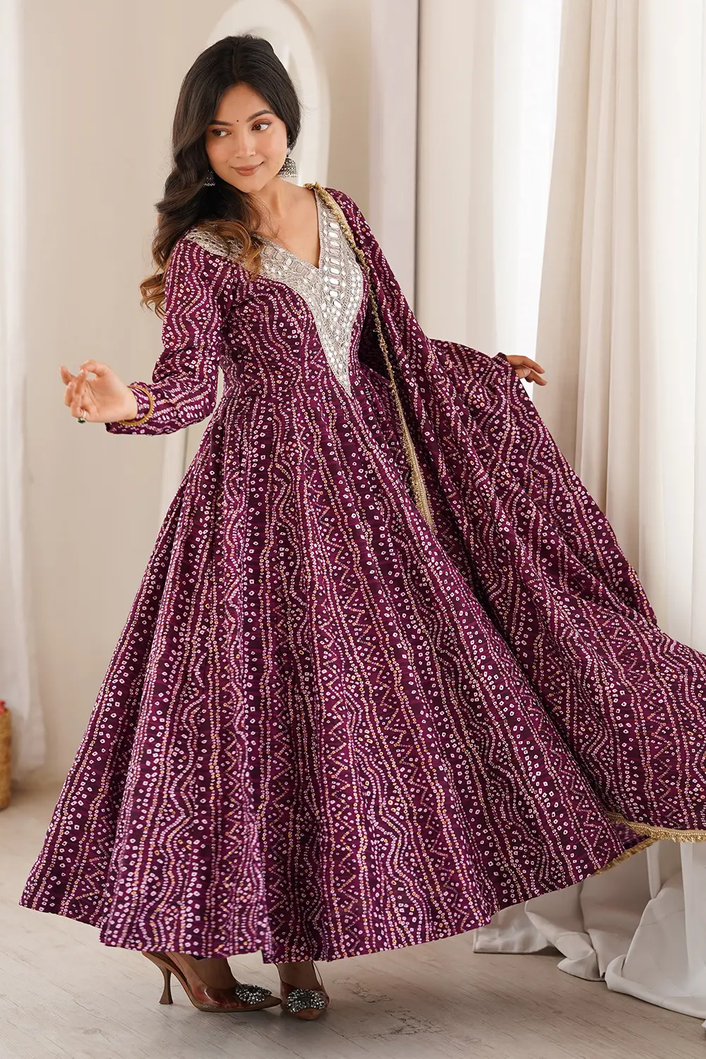 Mirror embroidery detail on purple rayon anarkali gown