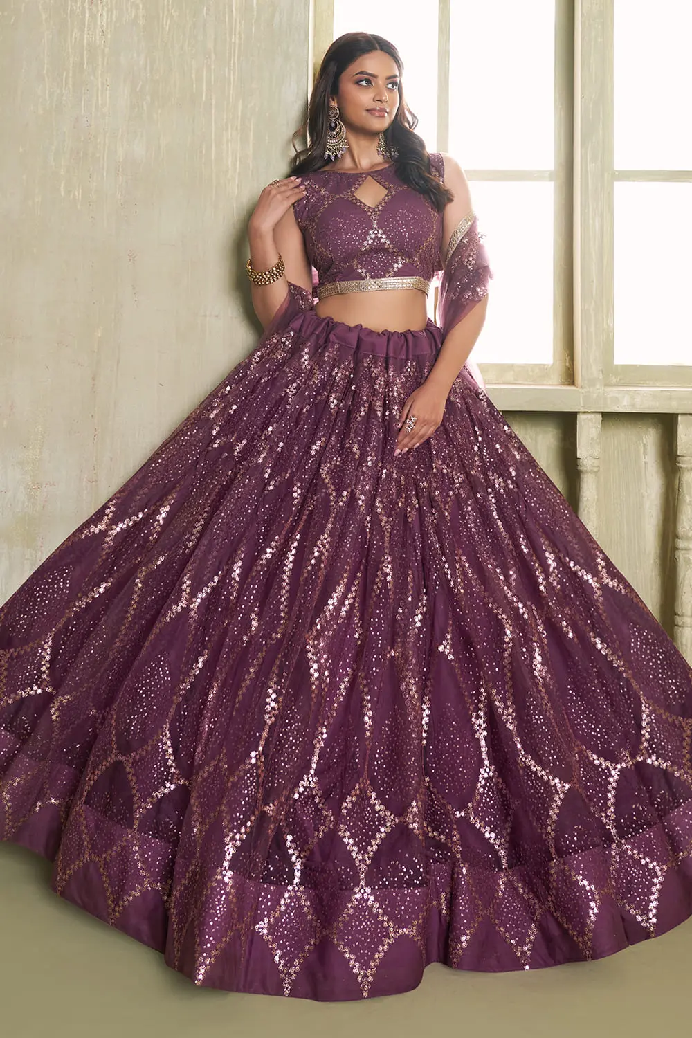 Wine butterfly net lehenga with fancy lace finish seated view