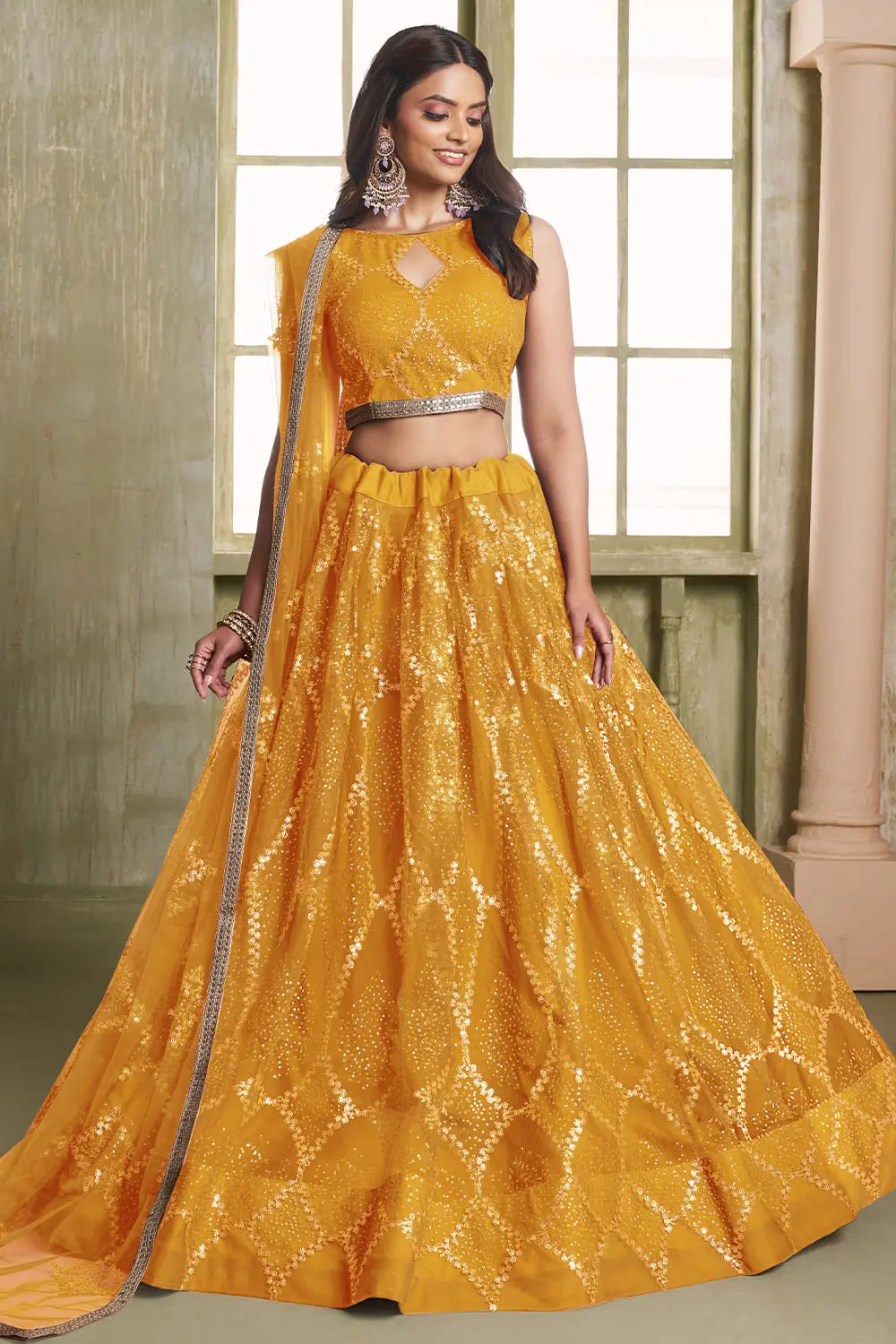 Yellow butterfly net lehenga with glitter sequins and flared can-can silhouette