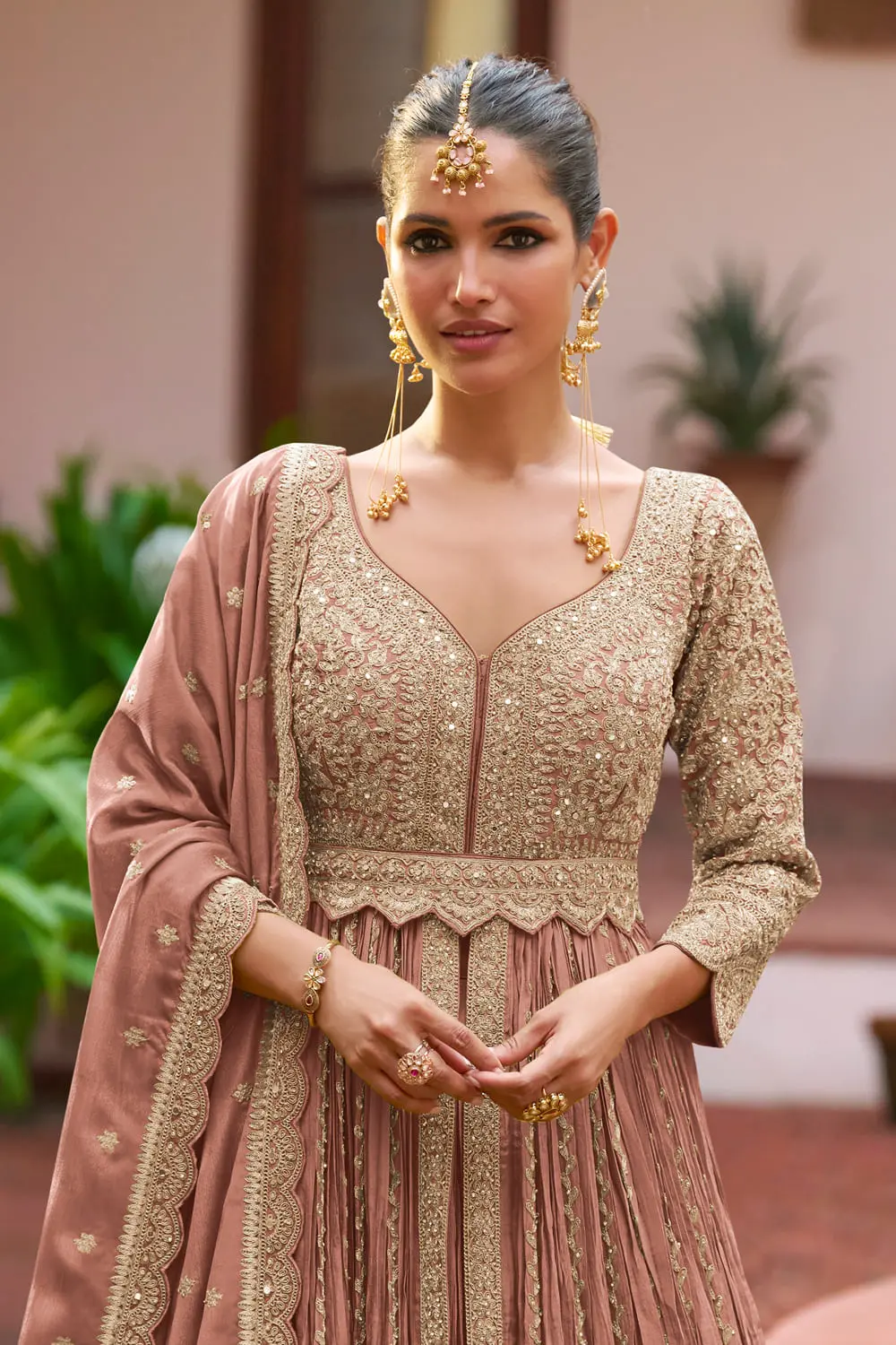 Close up of embroidery and handwork on dusty pink chinon anarkali skirt
