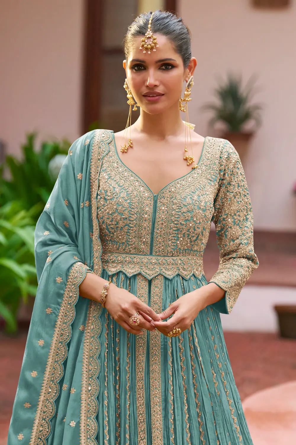 Close up of embroidery and handwork on teal blue chinon anarkali skirt