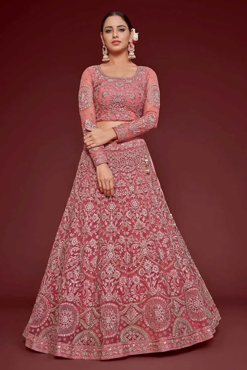 Barbie pink soft net lehenga styled with embroidered blouse and dupatta