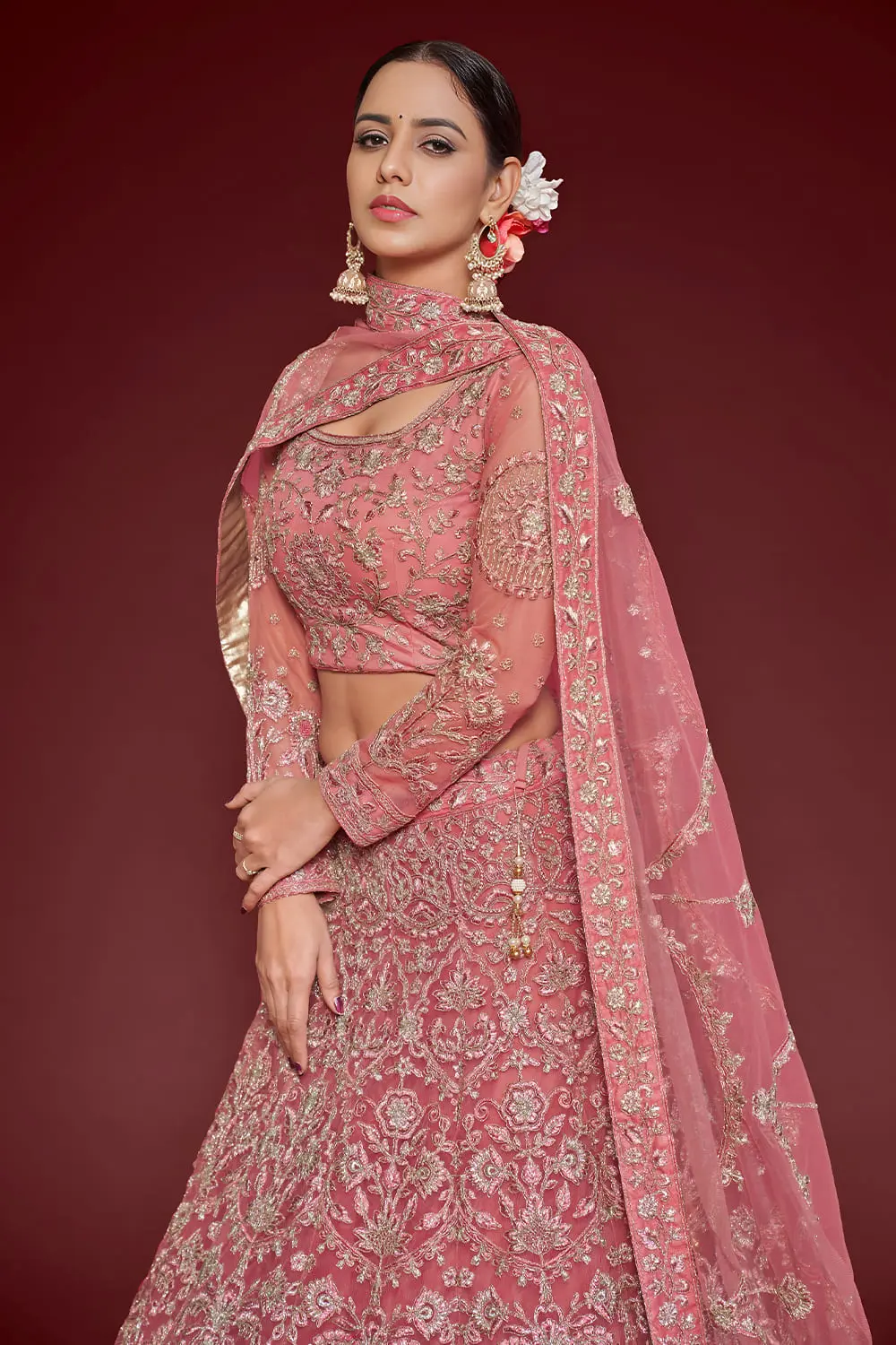 Close up of thread, zari and badla embroidery on barbie pink lehenga