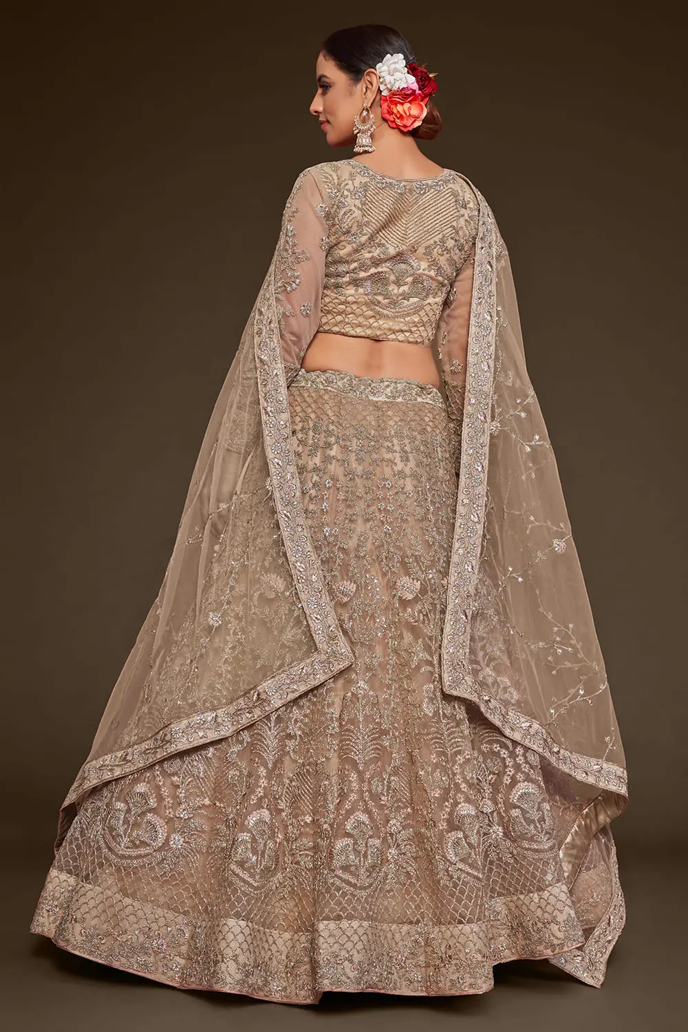 Golden badla and glitter dori embroidery on gold net lehenga skirt