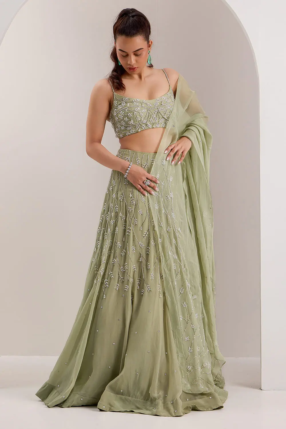 Mint green organza lehenga choli with crystal and cut dana embroidery by Khaish