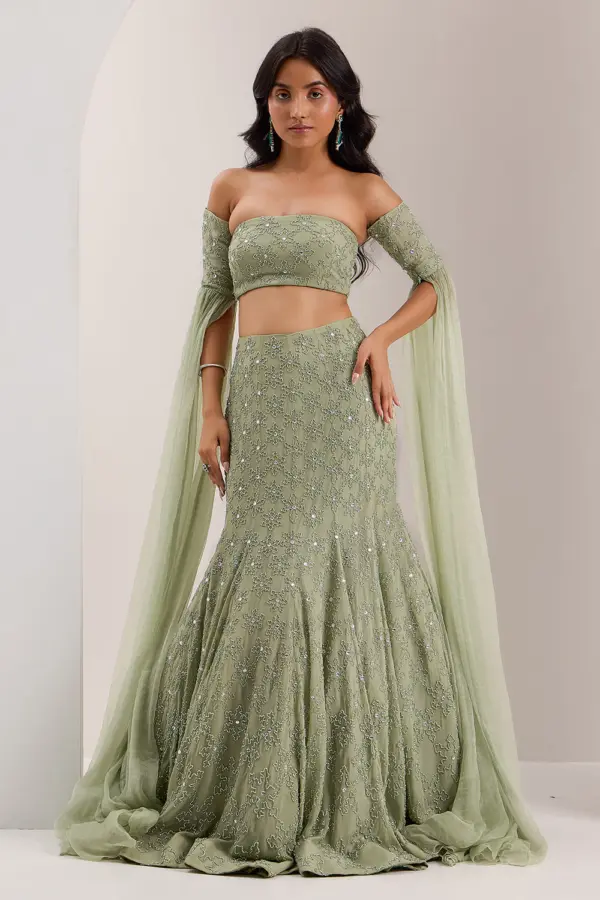 Mint green mermaid lehenga for wedding with off shoulder blouse by Khaish
