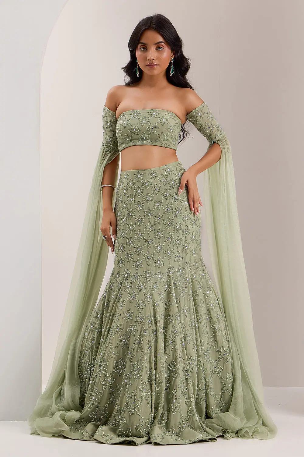 Mint green mermaid lehenga for wedding with off shoulder blouse by Khaish