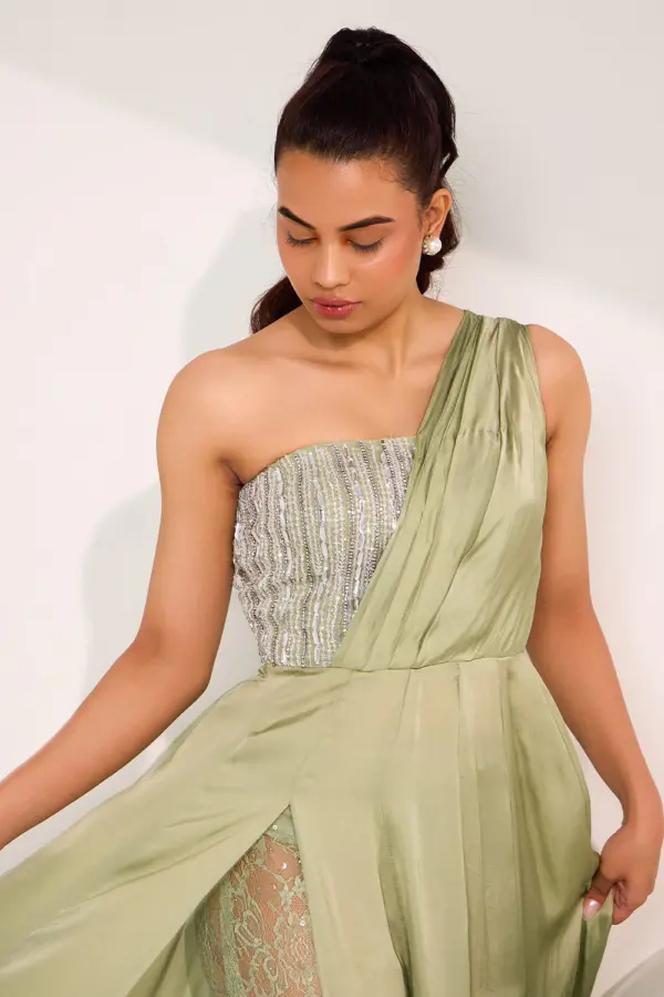 Close up of mix media embroidery on mint green one shoulder gown