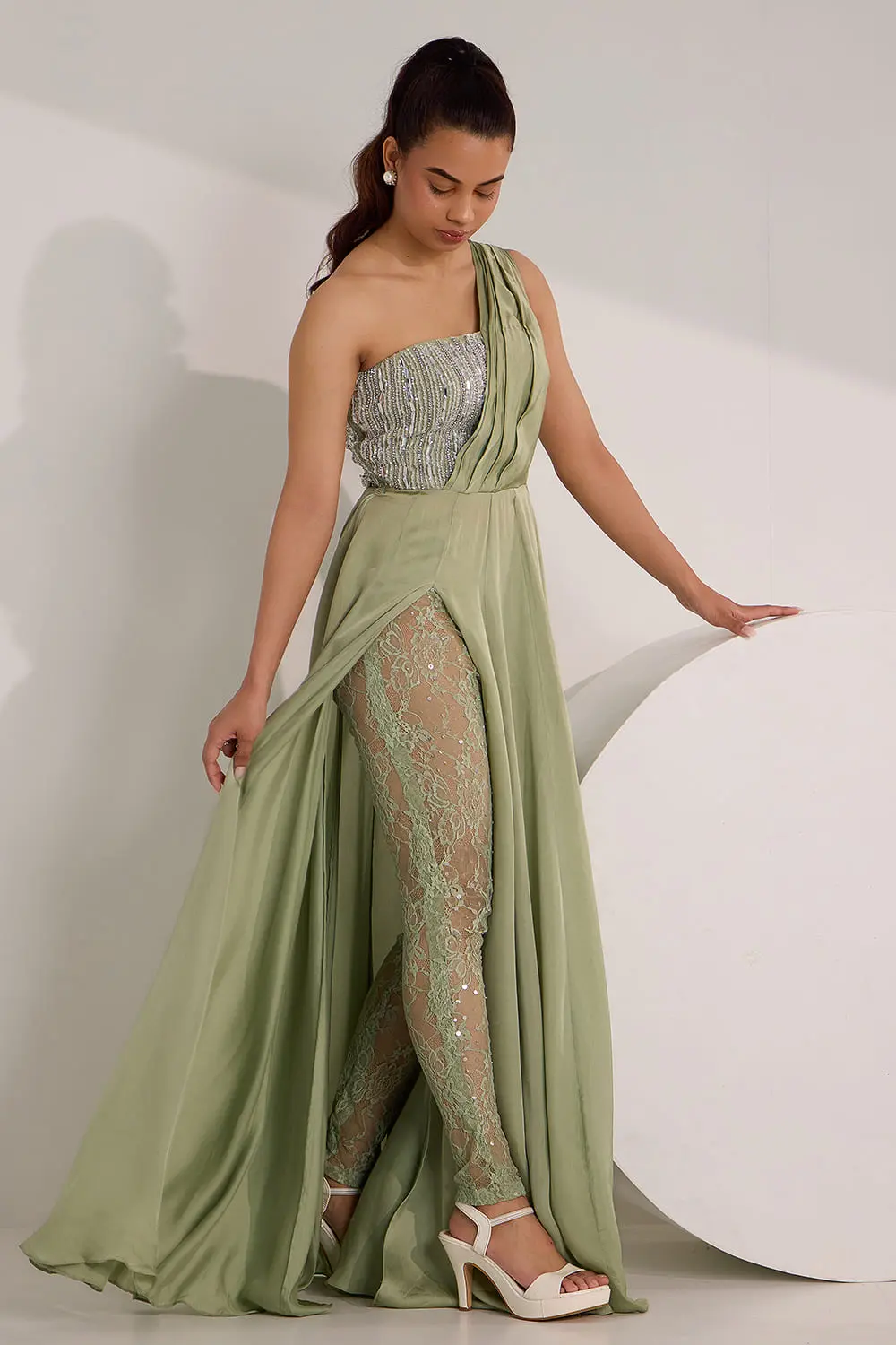 Mint green one shoulder gown with lace legging and crystal work