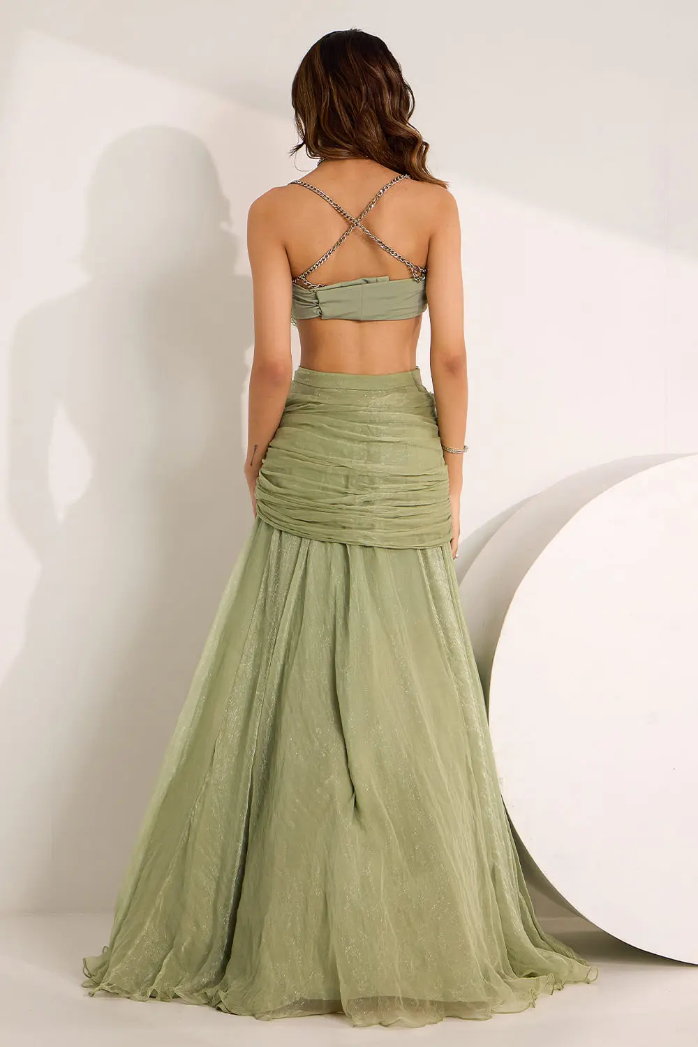 Back view of mint green draped cowl skirt set