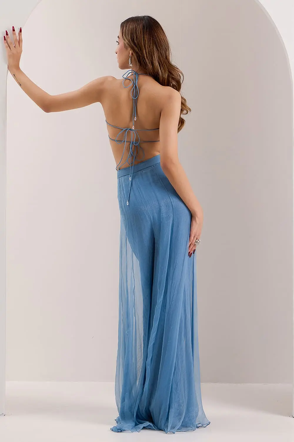 Back view of blue floor length cape and palazzo set